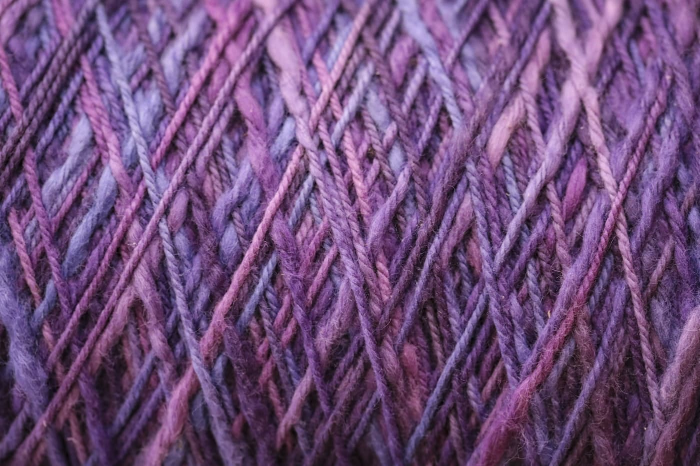Close-up of woven lavender and purple yarn texture